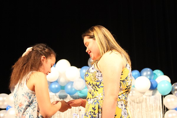 Eighth graders receive their rings at the Ring Ceremony